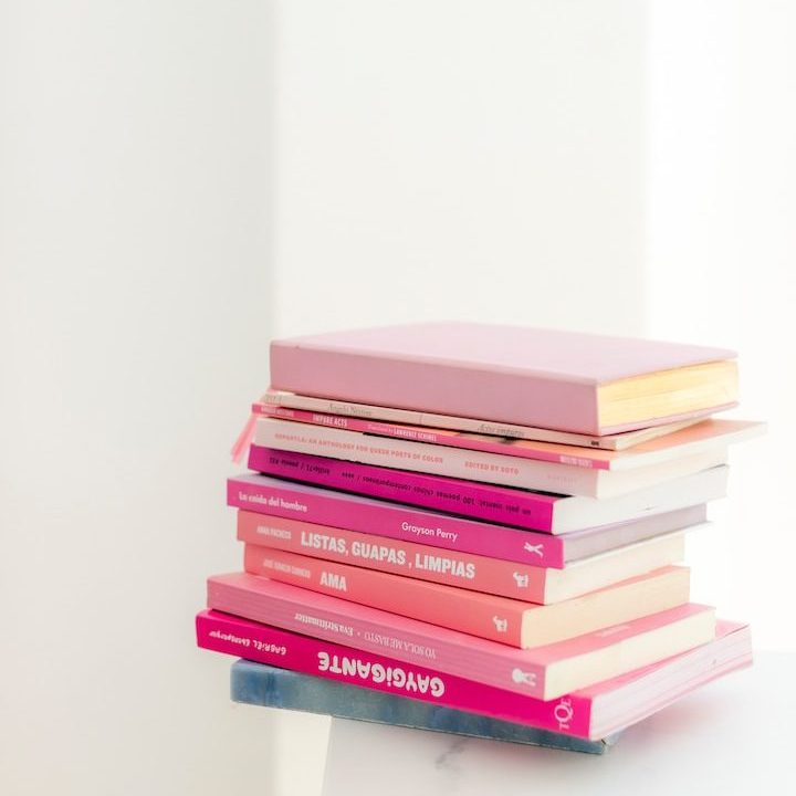 stack of books on white table